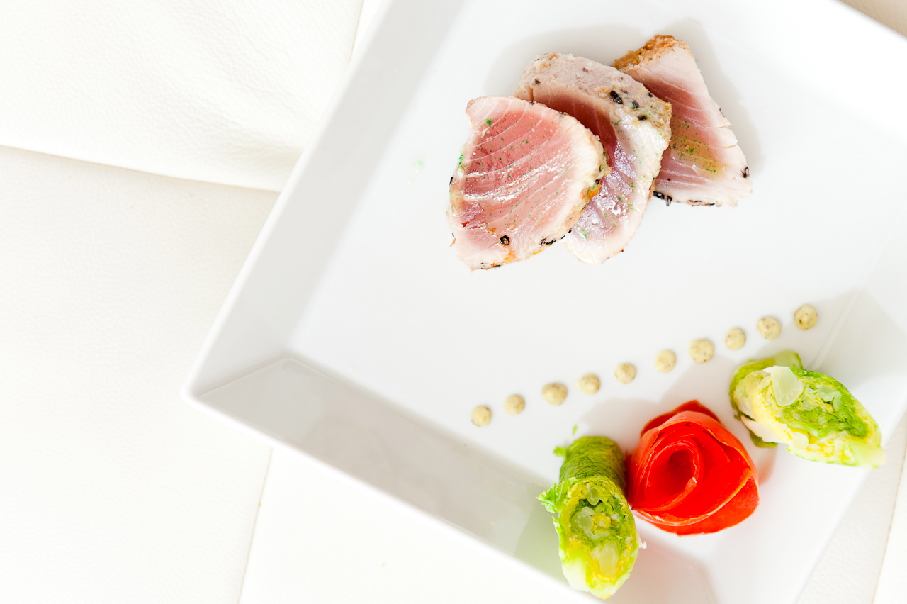 seared tuna au poivre with cabbage cigars and pink peppercorn aioli