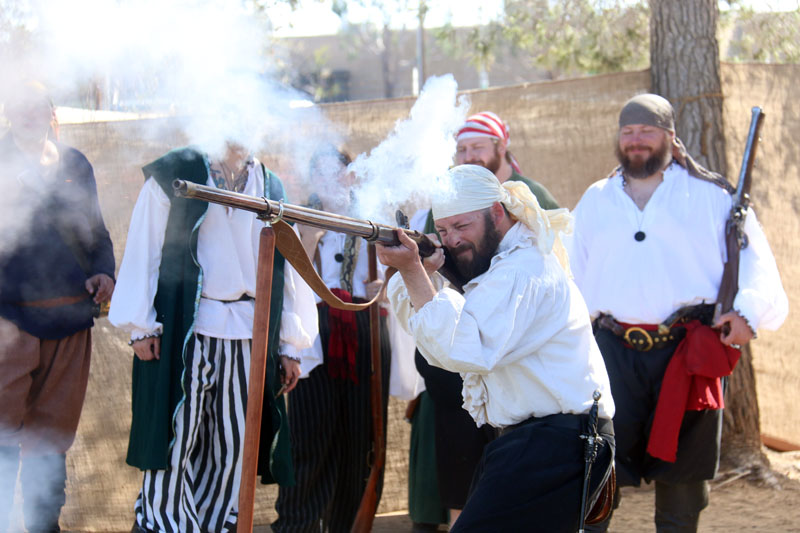 flintlock long gun firing; High desert pirate renaissance faire