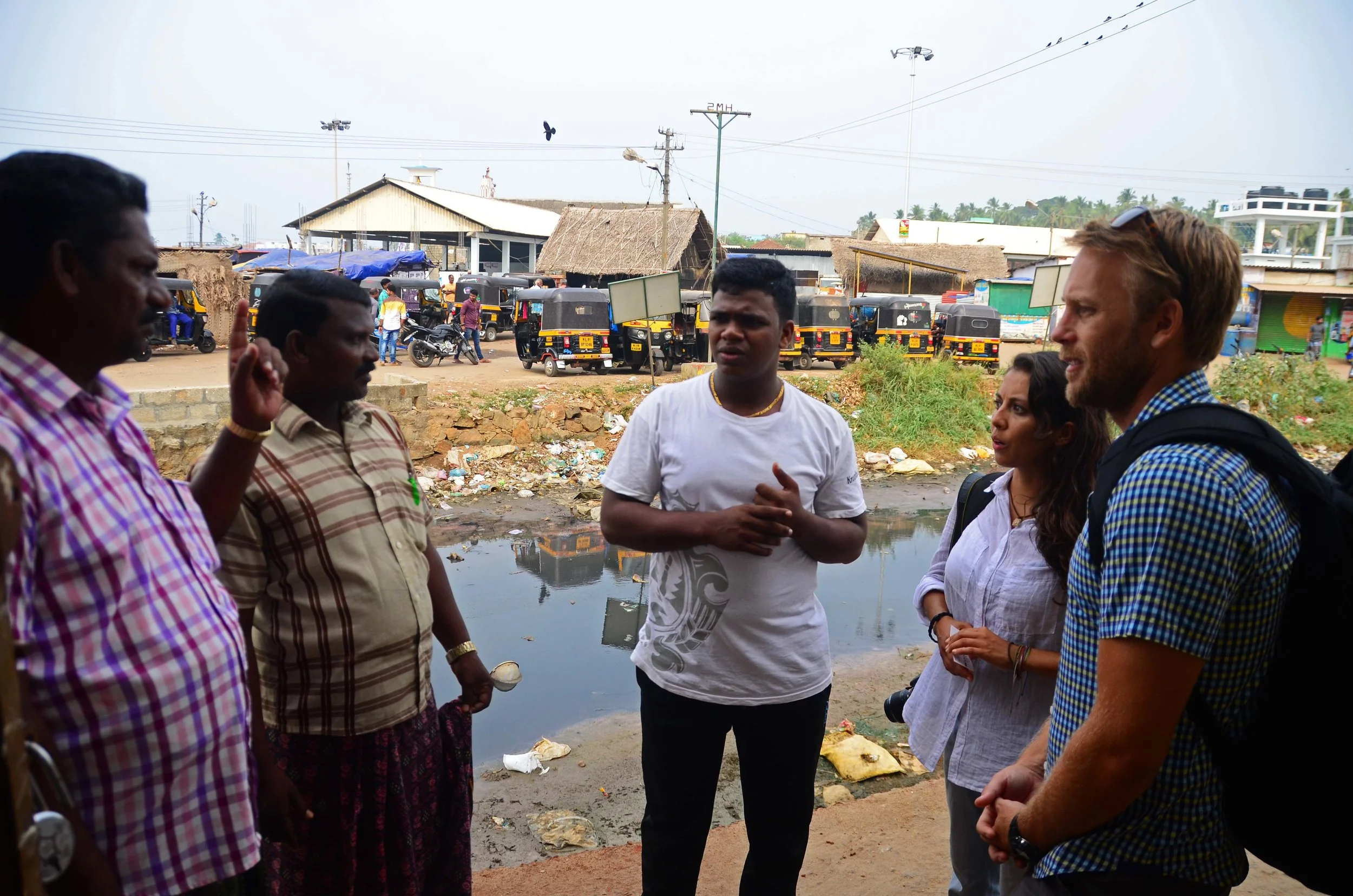 The team (from right) Cassidy, Elizabeth and our translator James (middle) discuss some of the issues facing the fishing industry in the region.