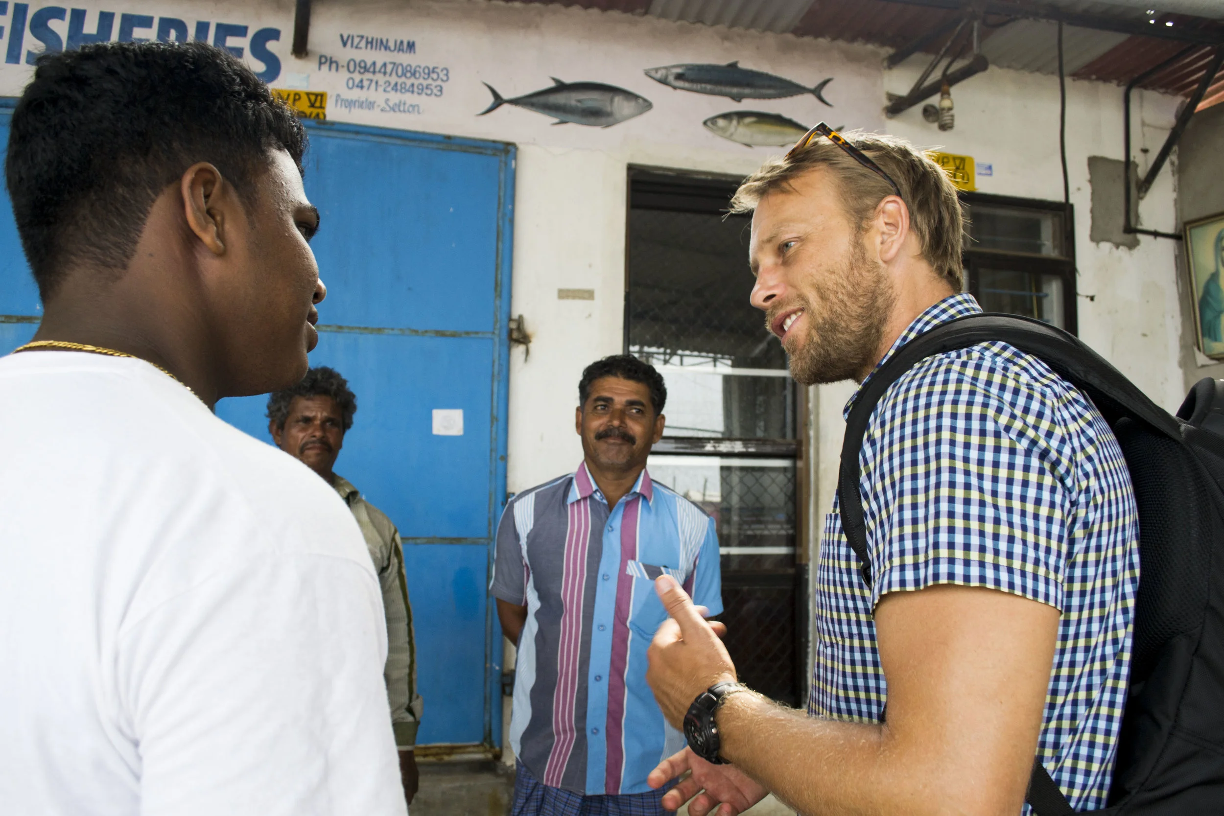 One of our fisheries team, Cassidy chatting to local fishermen about the issues that they see as key to affecting their livelihoods, as well as the future of their industry.
