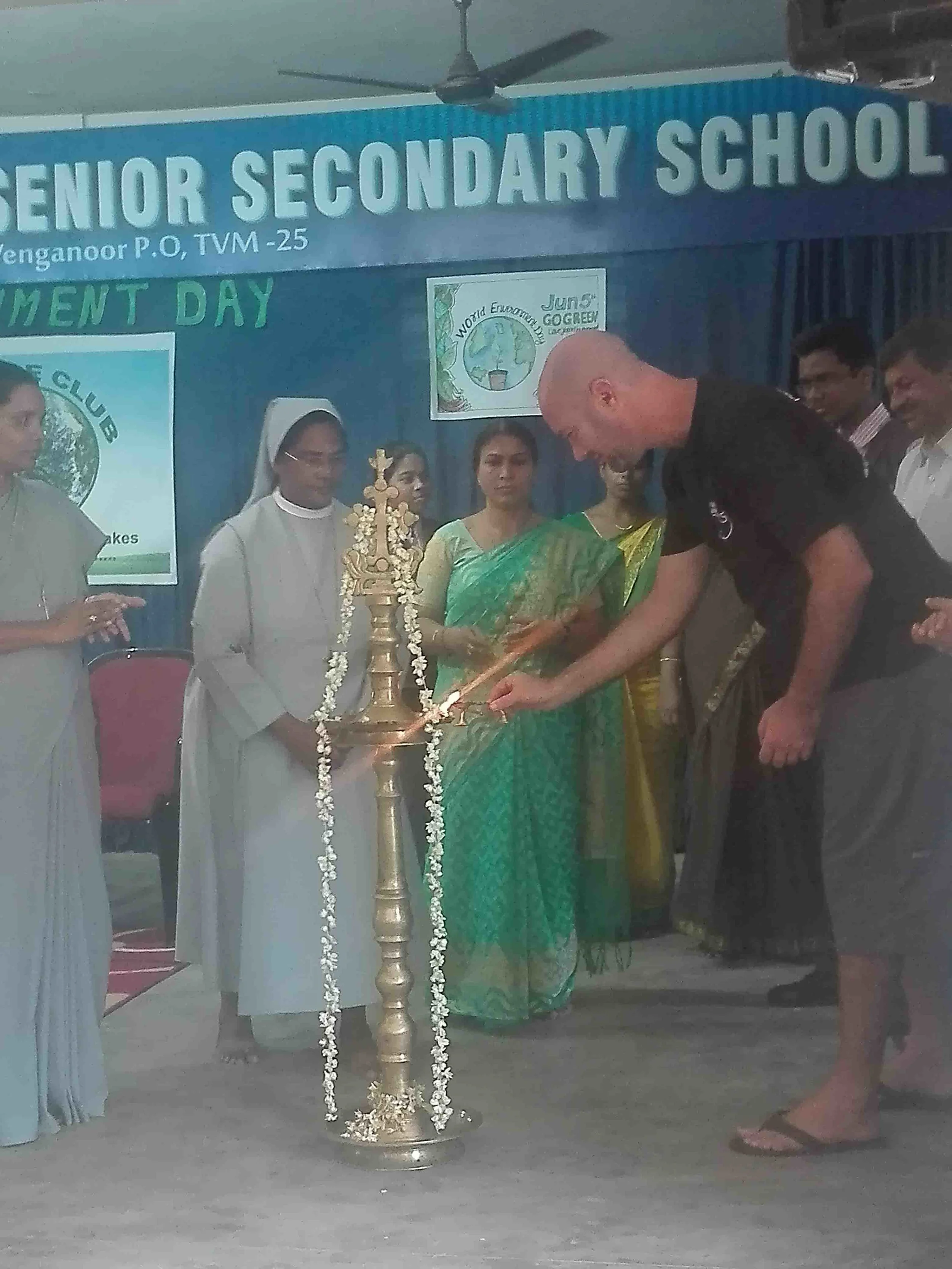 Lighting the pyre to mark the beginning of a local World Environment Day event.