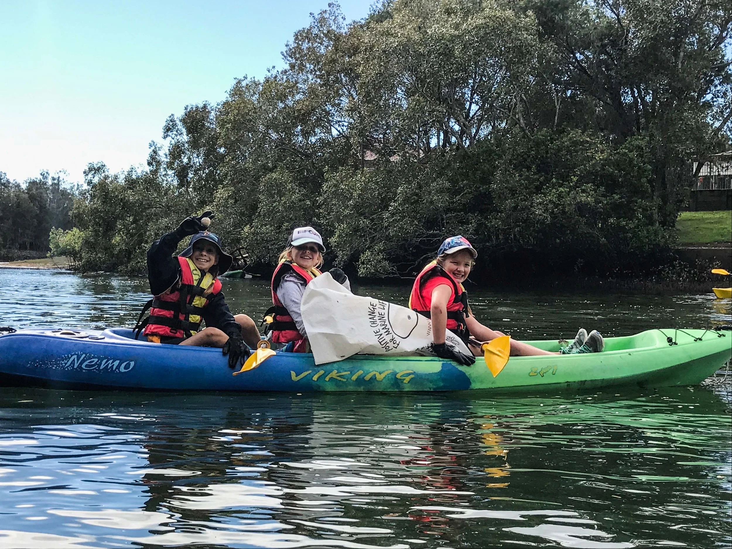 The kids getting their hands dirty, whilst learning about the impact that marine debris has on the creek.
