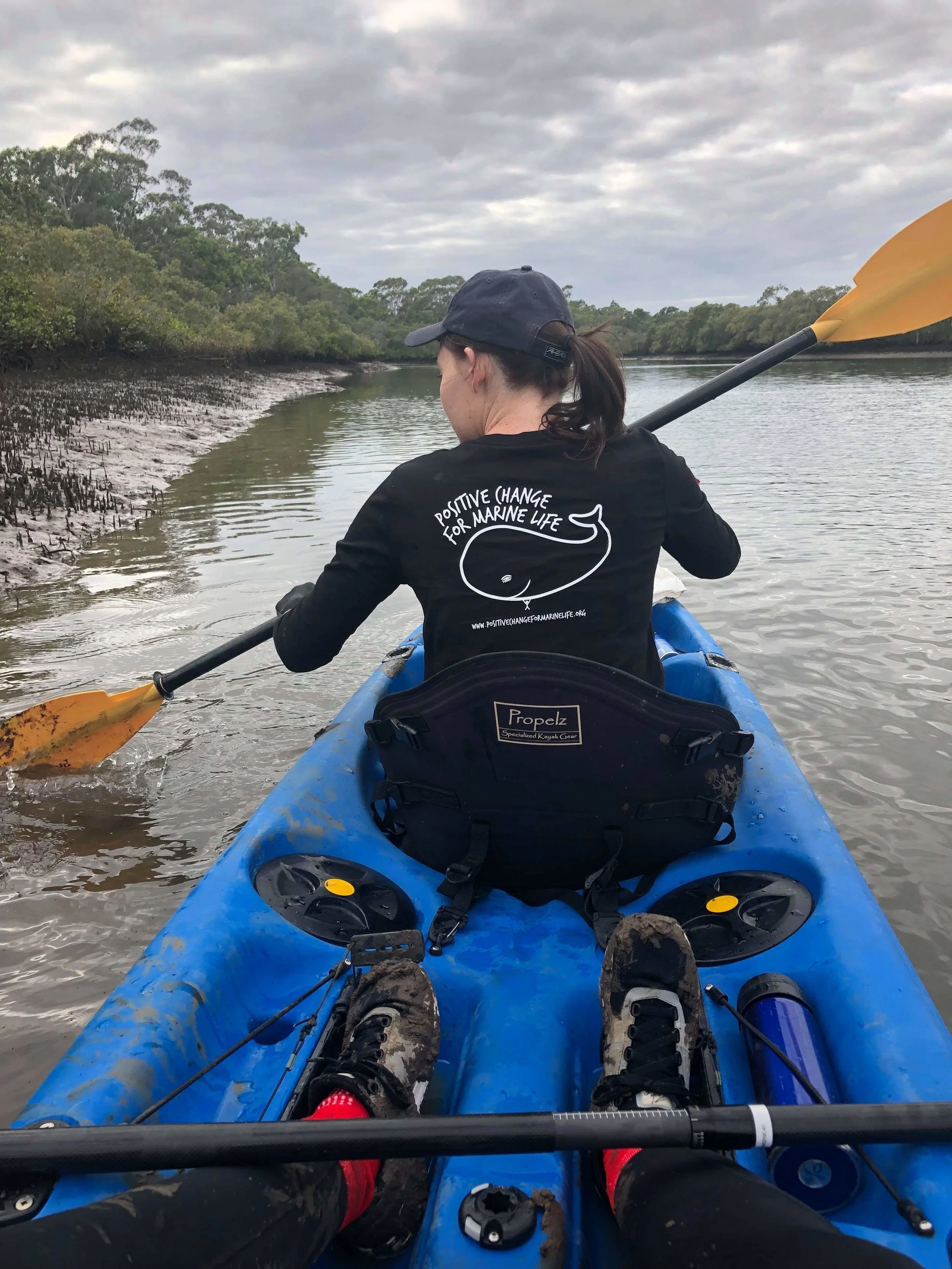 Kelly paddling hard against the current.