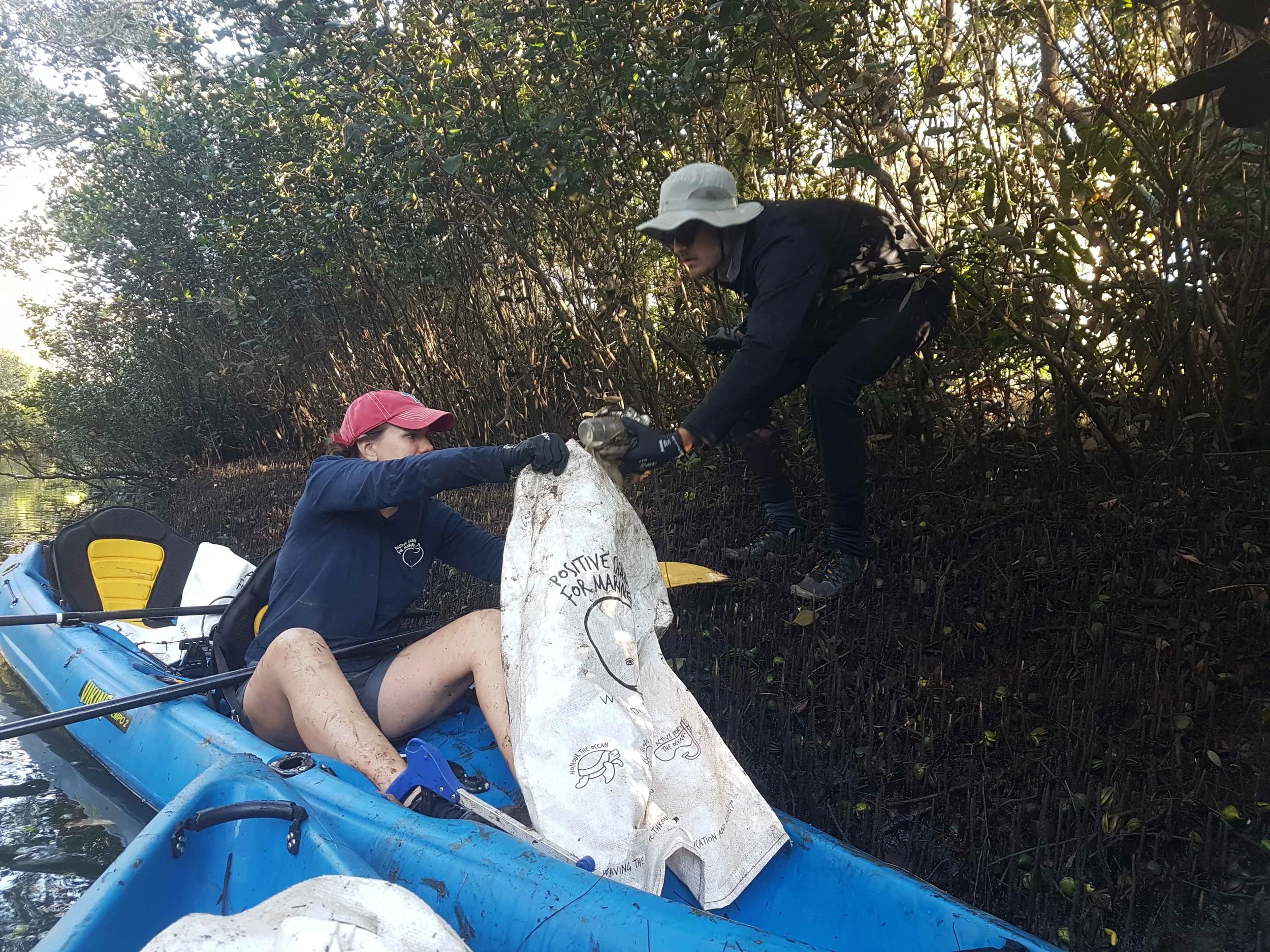 Hayden and Brittany getting in the mud during one of our surveys.