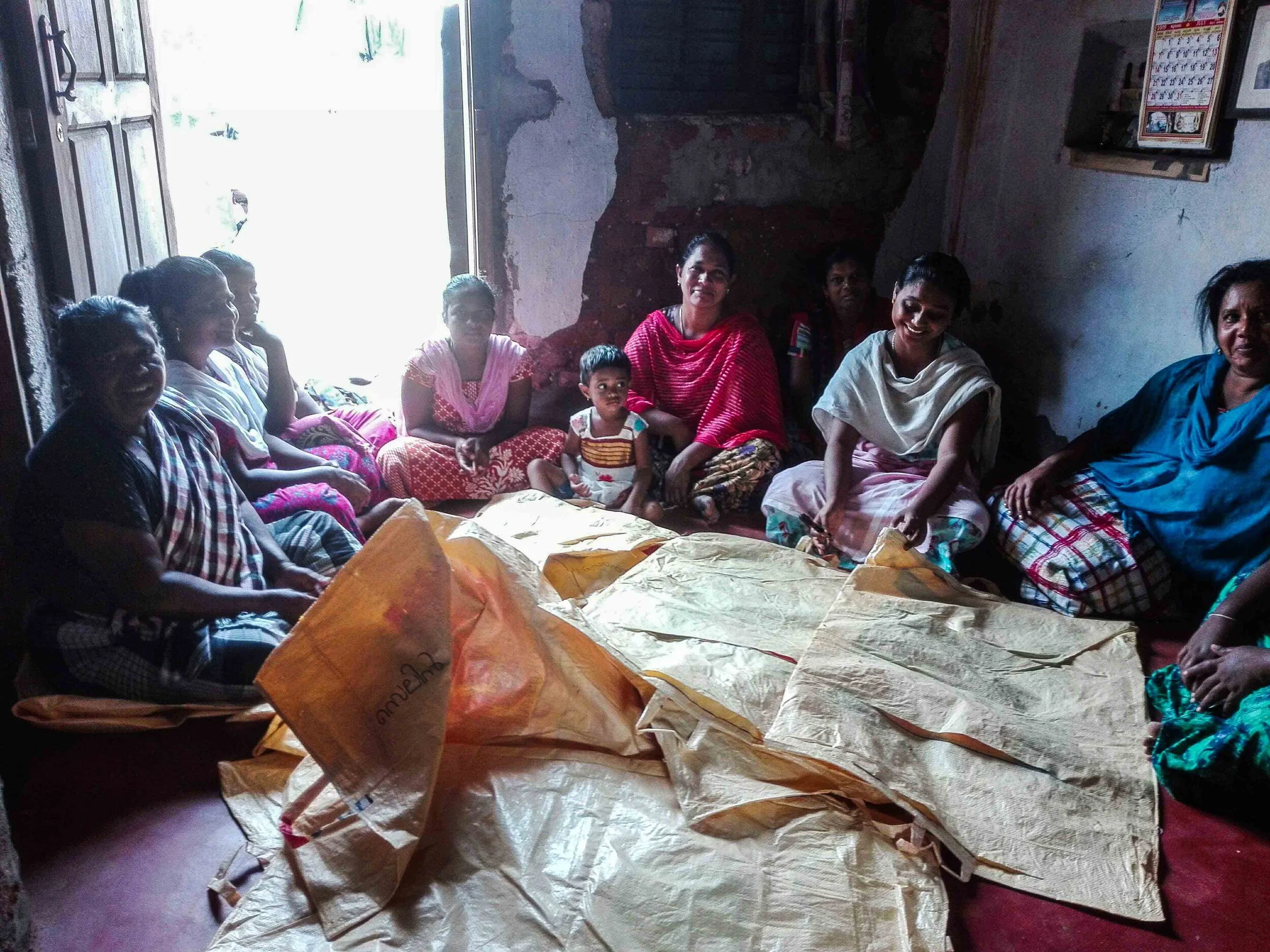 Local women sewing some of the multi-stream waste bags.