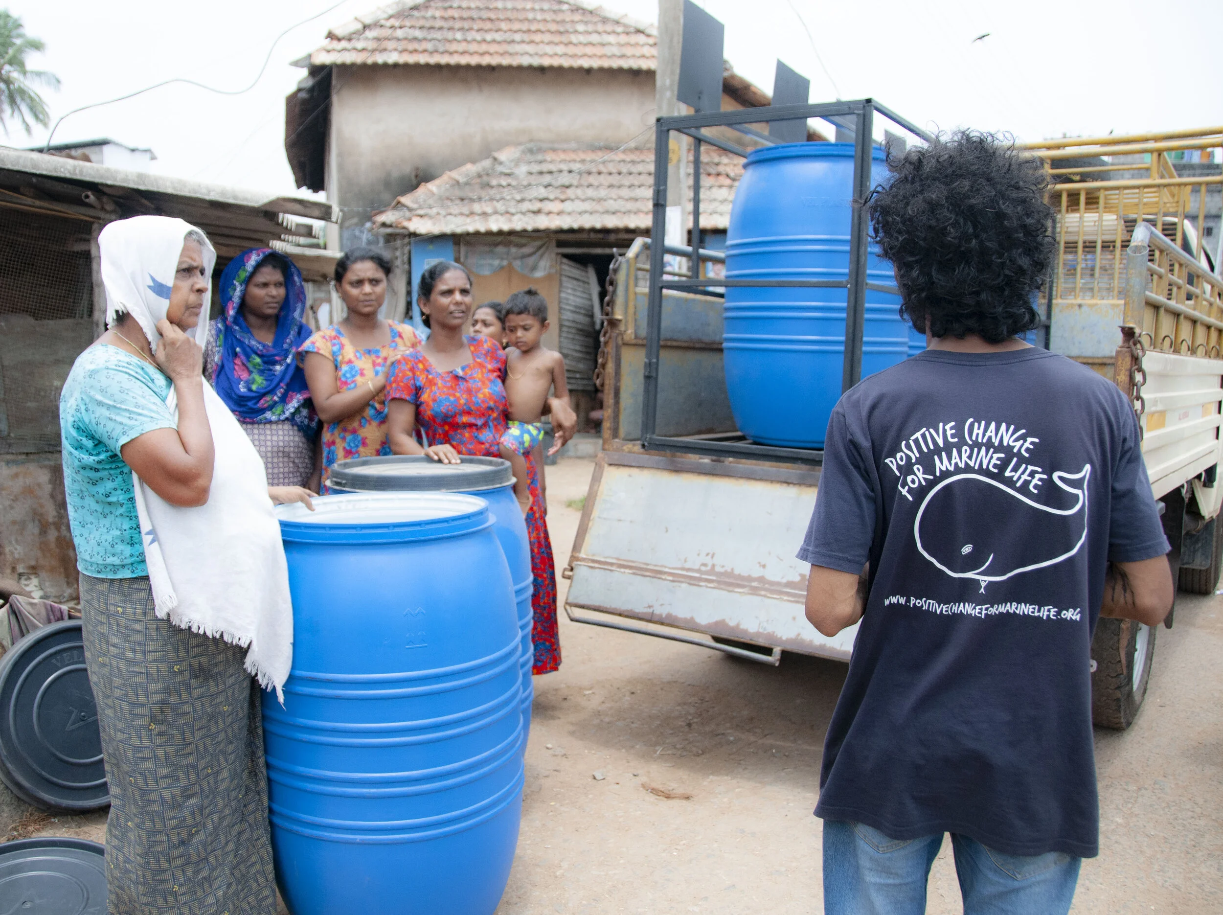 Krishna delivering our new recycling bins to the community in Kottapuram.