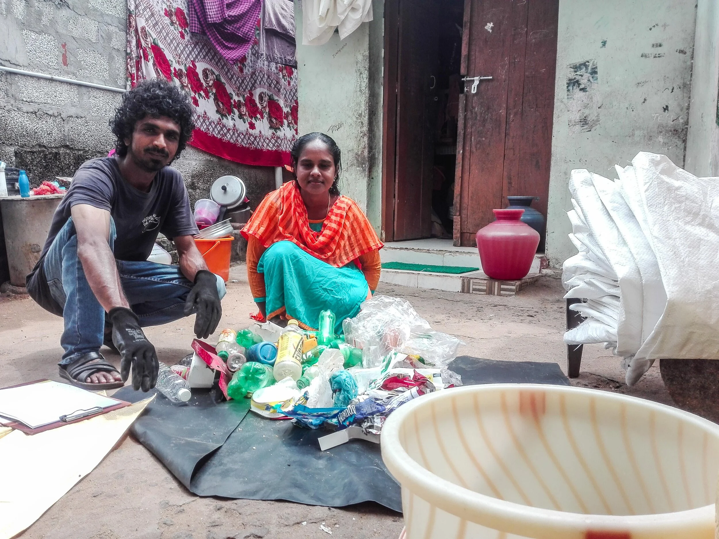 Teaching women from the local households how to segregate and sort their waste.