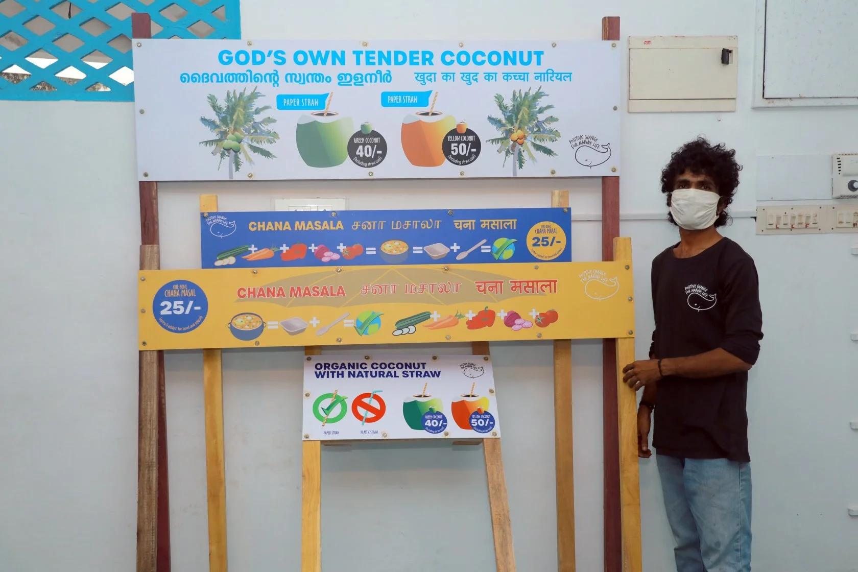Krishna working on building our vendor signs (made to their specs) during lockdown in Kerala.