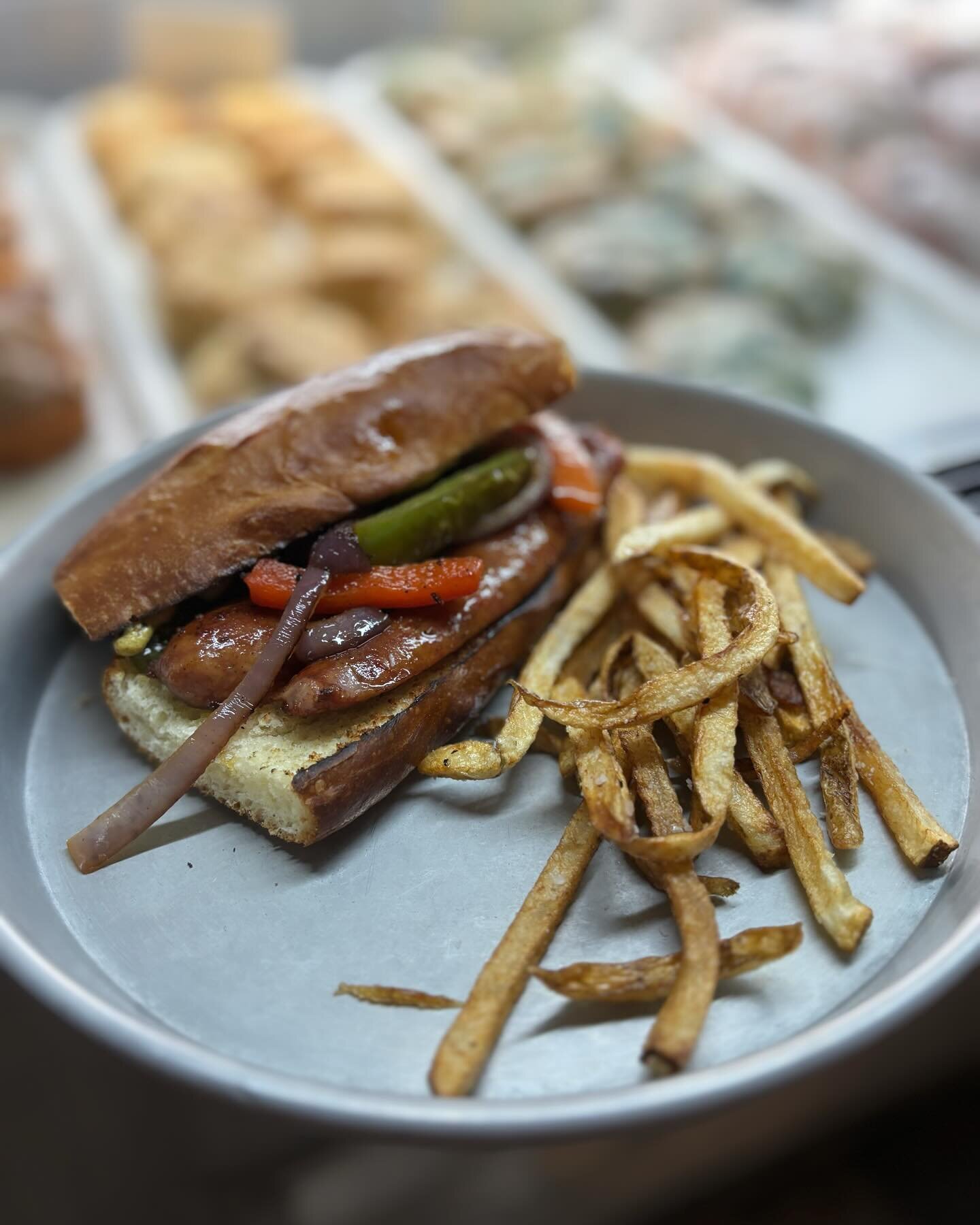 Saturday special: Conecuh dog with peppers, onions, spicy mustard . On home made hotdog bun. Served with choice of side . #saturday #special #warehousebakeryanddonuts #fairhope #fairhopealabama #sweethomealabama #artsandcraftsweekend #bakery #spring 