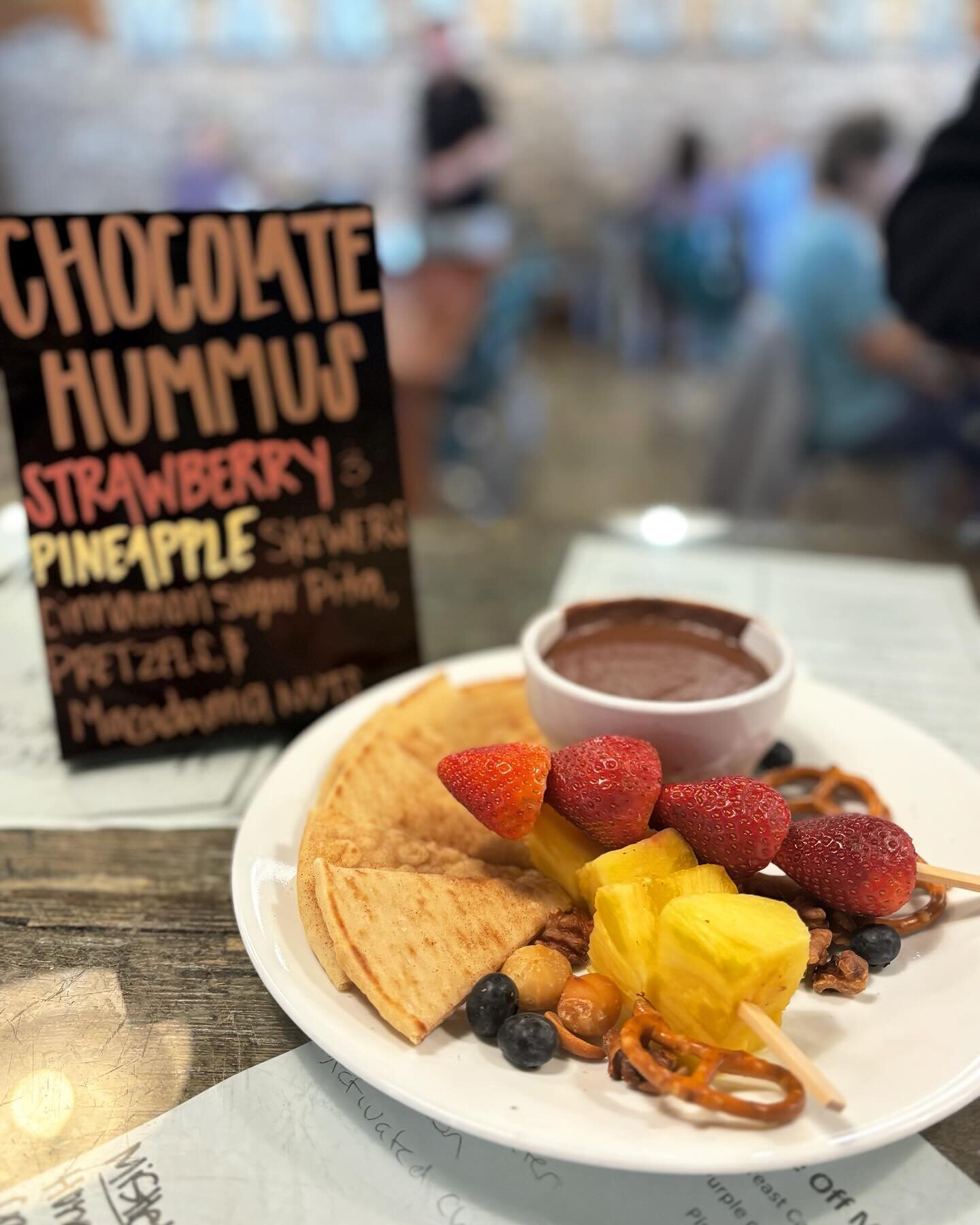 Special of the day : house-made chocolate hummus . Served with cinnamon sugar pita, strawberry and pineapple skewers, pretzels, and roasted macadamia nuts. *vegan* #warehousebakeryanddonuts #fairhope #fairhopealabama #madefromscratch #hummus #chocola