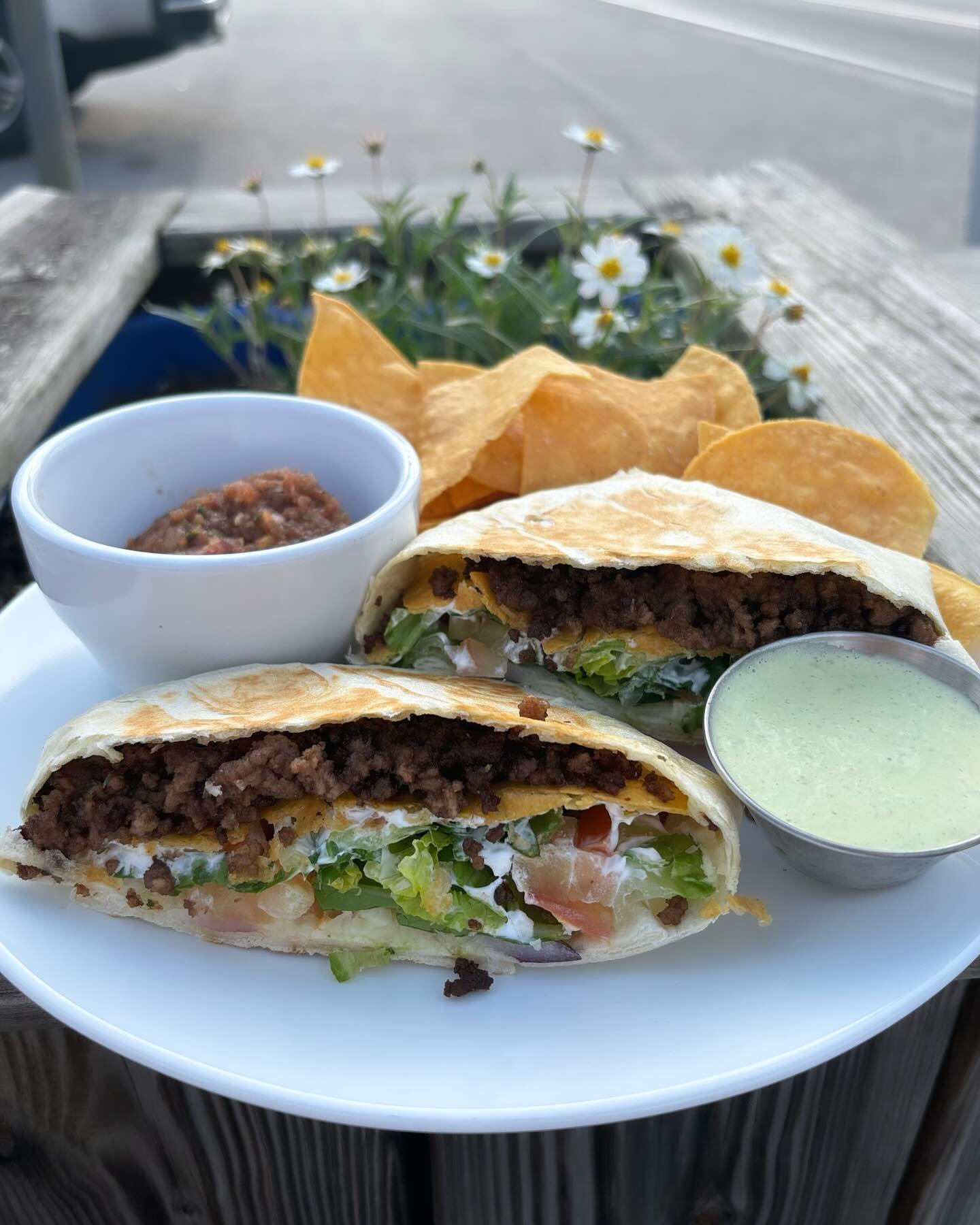 Special of the day : crunch wrap : seasoned beef, lettuce, tomato, onion, cheese, sour cream, all wrapped in a hard shell and flour tortilla . Served with a side of jalape&ntilde;o Dijonnais&rsquo;s and chips and salsa.#warehousebakeryanddonuts #fair