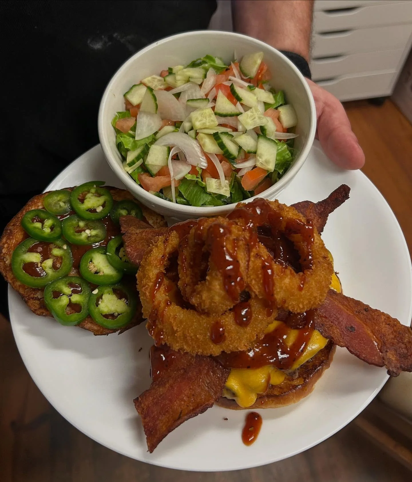 Today&rsquo;s special is a Rodeo BBQ Burger with bbq sauce, cheddar, bacon, jalape&ntilde;os, and onion rings served with your choice of side. #special #burgers #warehousebakeryanddonuts #fairhopealabama #eatlocal