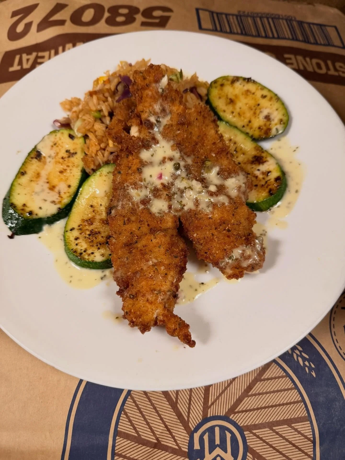 Today&rsquo;s special is fried sheepshead fresh from Fairhope Fish House on a bed of veggie pilaf rice, grilled zucchini, topped with lemon capper burred blanc. #fairhopefishhouse #local #warehousebakeryanddonuts #lunchspecial #fairhopealabama #fresh