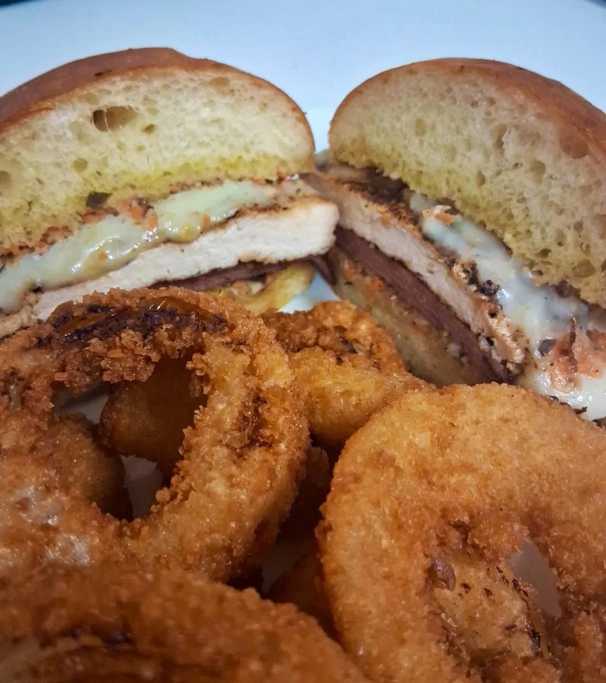 We have a chicken muffuletta special in the house today! Made with salami &amp; mozzarella and a homemade olive salad- all in the freshest of freshly baked buns! This comes with a choice of a side for $11 - do yourself a favor and come get one! 🤤