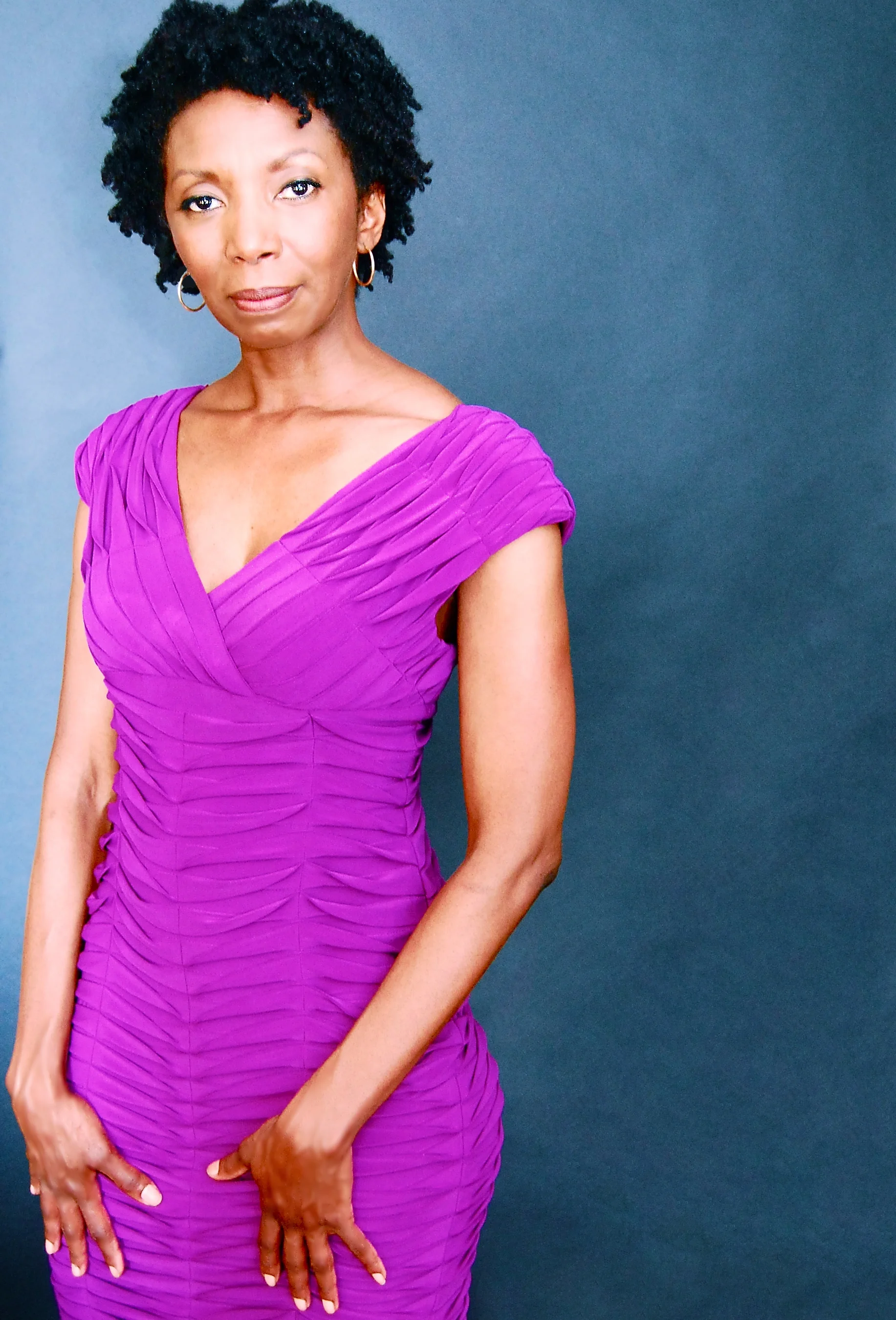 At a photoshoot wearing Adrianna Papell I