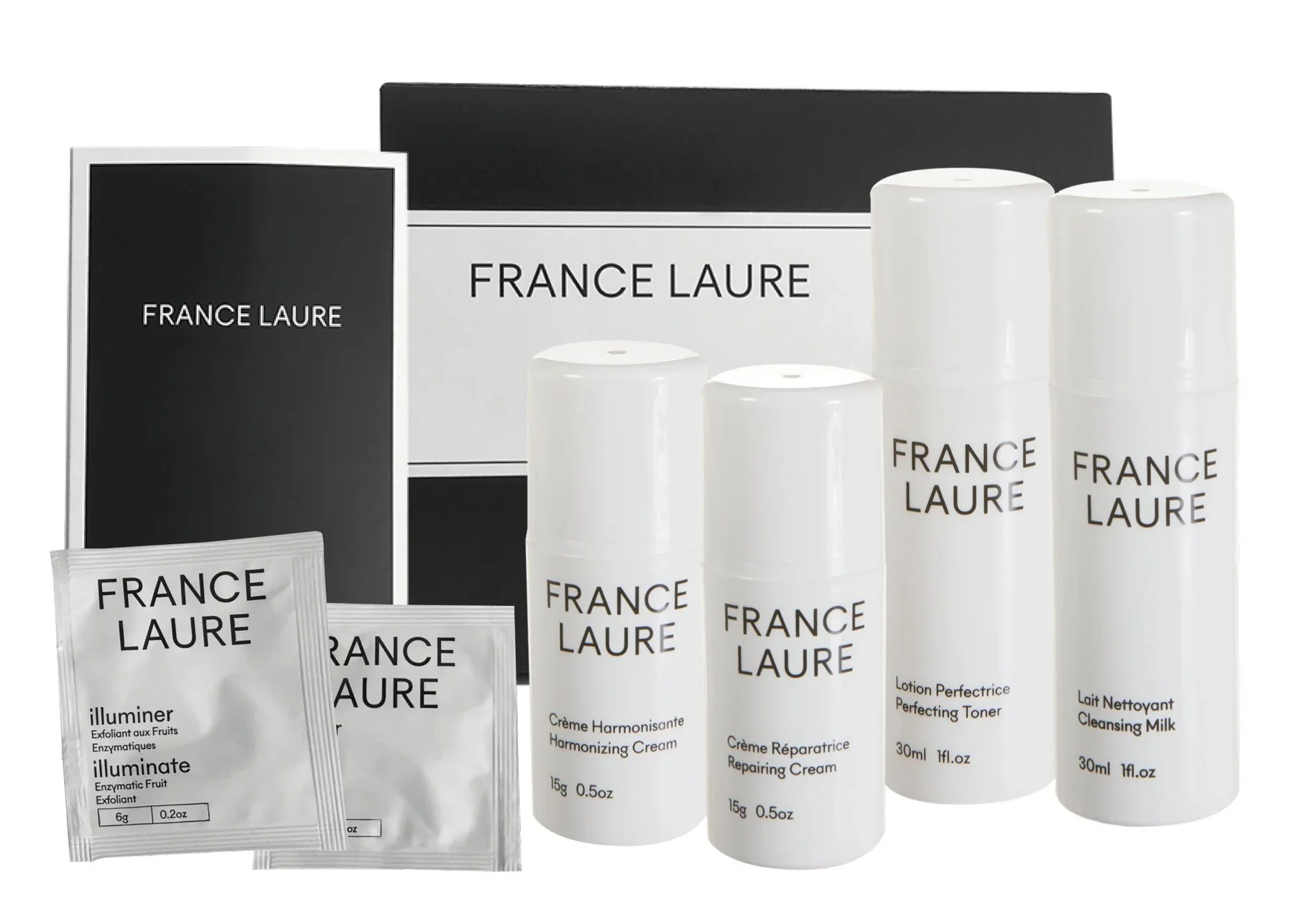 A collection of skincare products from France Laure, including illuminating enzyme exfoliant, harmonizing cream, repairing cream, perfecting toner, and cleansing milk, with their packaging and box.