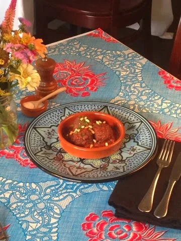 This week, Eat Up, Drink Up shared a fond recipe of ours on the blog. Thanks Juanina, I think you’re right, Athens is full of lucky dawgs.
“I discovered this dish on a trip the Middle East and instantly fell in love. I love the savory spice of the lamb with a touch of sweetness from the cherries. About 20 miles south of Athens, the Stewart’s of World Shepherd Lamb Project are raising beautiful lamb in pristine meadows. We are so fortunate to have such a wonderful supplier of lamb on our doorstep.” - Chef Peter Dale
Lamb Meatballs with a Dried Cherry Sauce
4-6 servings
2 c dried sour cherries
2 c warm water
2 lbs marbled boneless lamb shoulder, trimmed of sliver skin and gristle, meat and fat finely ground (or use ground lamb from your butcher)
1 tsp cinnamon
1 tsp ground cumin
Kosher salt & freshly ground pepper to taste
¼ c plus 1 T vegetable oil
2 medium onions, coarsely chopped
3 T fresh lemon juice
2 T flat-leaf parsley leaves
cinnamon to taste
Aleppo pepper to taste (optional)
In a bowl, soak the dried cherries in the water until softened, about 30 minutes. In a large bowl, spread the lamb in an even layer. In a small bowl, combine the cinnamon, allspice, 2 ½ teaspoons of salt and ½ teaspoon of pepper. Sprinkle the spices over the lamb and knead them in. Form the lamb into ¾ -inch meatballs; you should have about 60. In a large skillet, heat 2 tablespoons of the oil until shimmering. Add the meatballs and cook over high heat, shaking the pan, until lightly browned outside and rare in the center, about 4 minutes. Drain well.
In a large saucepan, heat the remaining 3 tablespoons of oil. Add the onions and cook over moderately low heat, stirring occasionally, until softened and golden, about 12 minutes. Add the cherries and their soaking liquid and the lemon juice and simmer over moderate heat for 10 minutes. Add the meatballs and any accumulated juices and simmer over low heat until they are slightly pink inside and the sauce has reduced slightly, 5 to 10 minutes. Season with salt and pepper, garnish with the parsley and serve with pita.