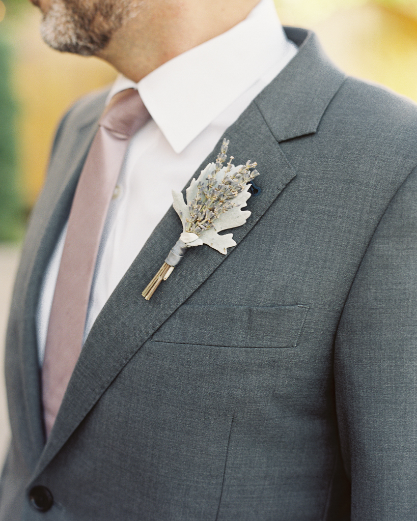 Groomsman with Coral Pink Tie Grey Suit and Rustic Bouitineer
