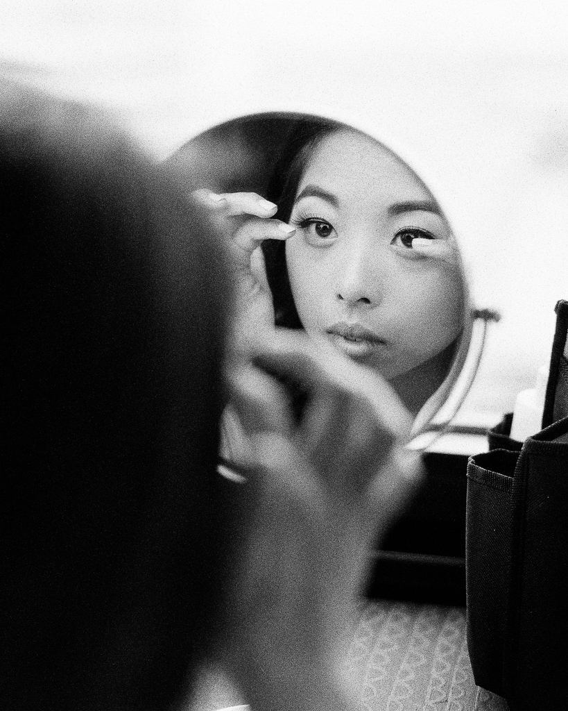 Bride Getting Ready Looking in the Mirror.jpg