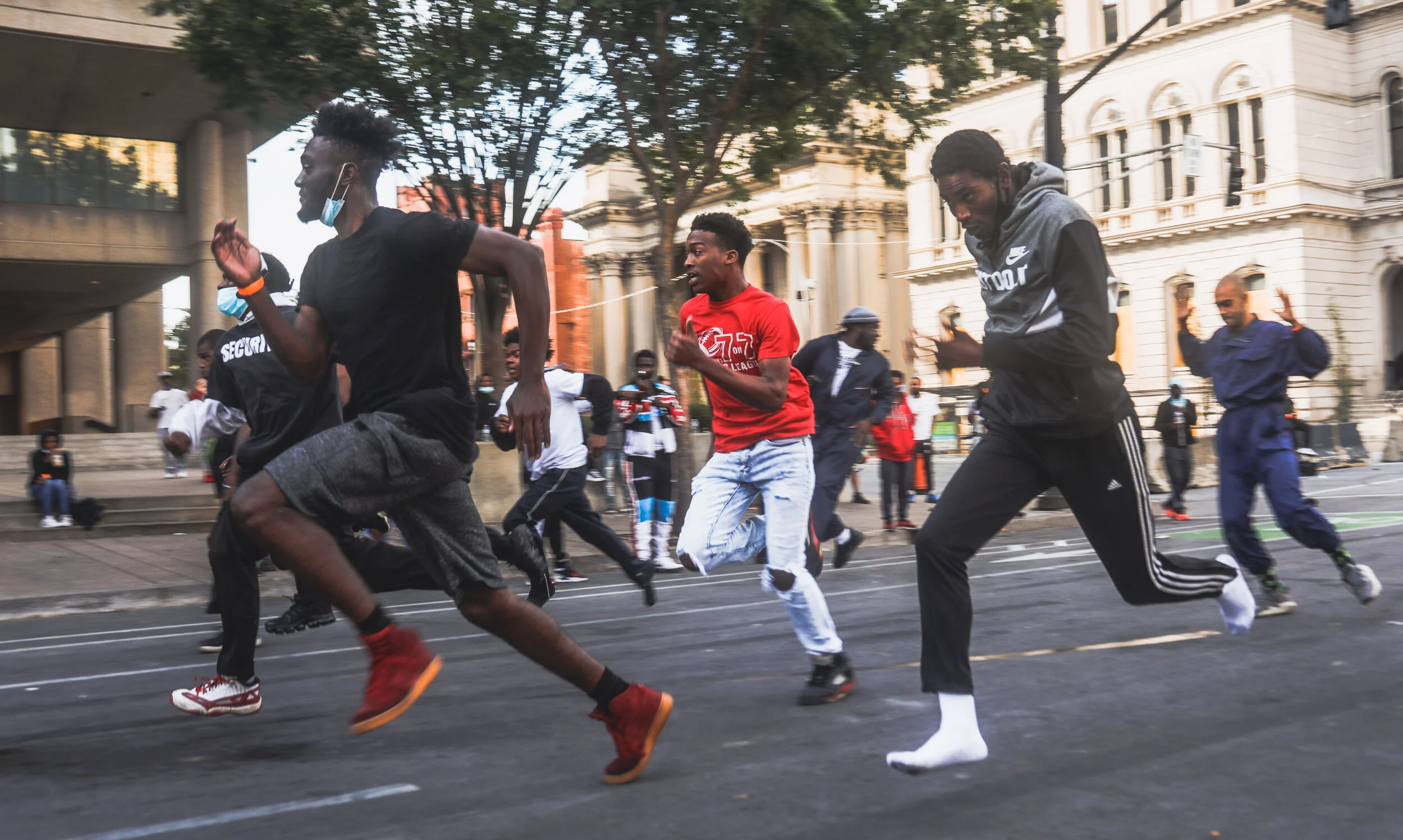 A footrace breaks out during a respite from protests in downtown Louisville (Copy)