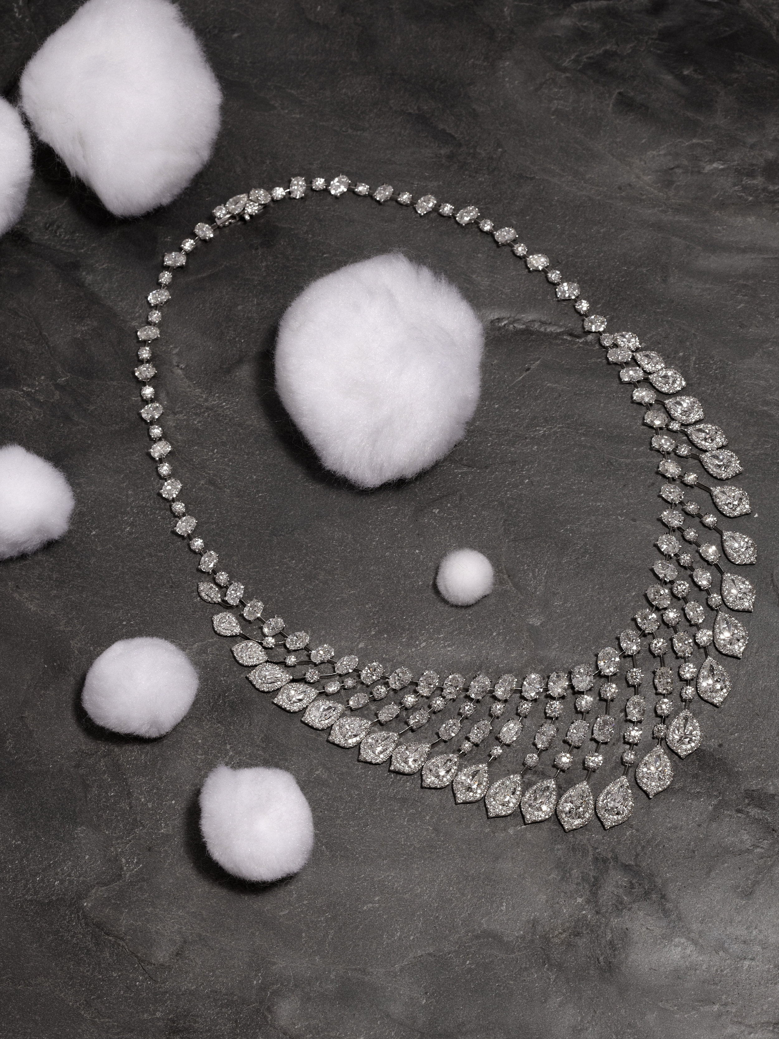 Pear shape and oval diamond wave necklace with micro-set diamond surrounds in 18ct white gold
