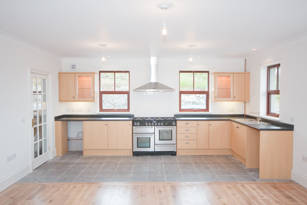 Open plan kitchen with Gas range cooker and underfloor heating.