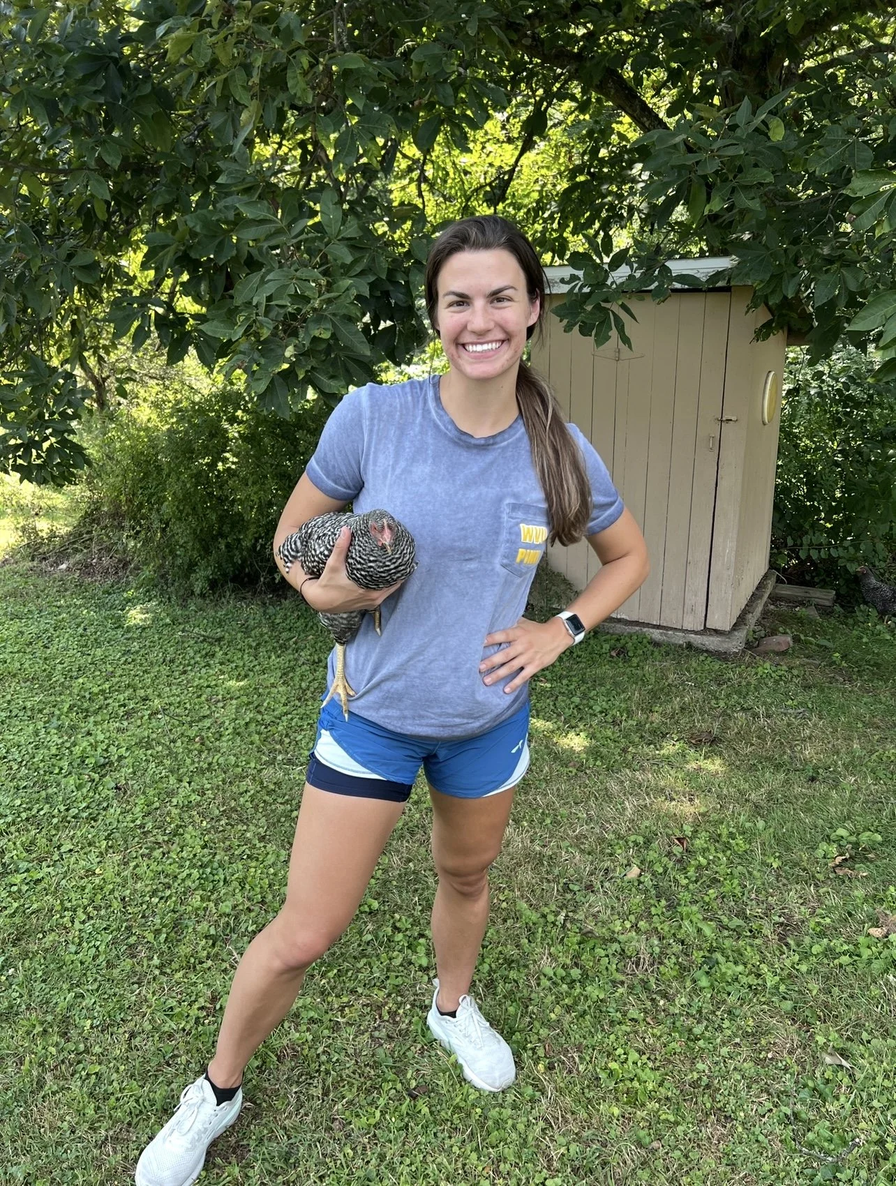 Coach Kinder holding a chicken