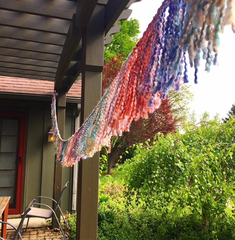 My sister Anna surprised me by flying in from Philly, and she had packed yards and yards of handmade yarn garland that she had tediously strung in different hotels rooms all over the US, since her job has her traveling constantly. How sweet is that!? I brought it home and hung it over my bed.