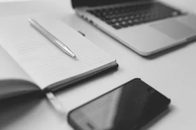 https://www.pexels.com/photo/iphone-notebook-pen-working-34578/