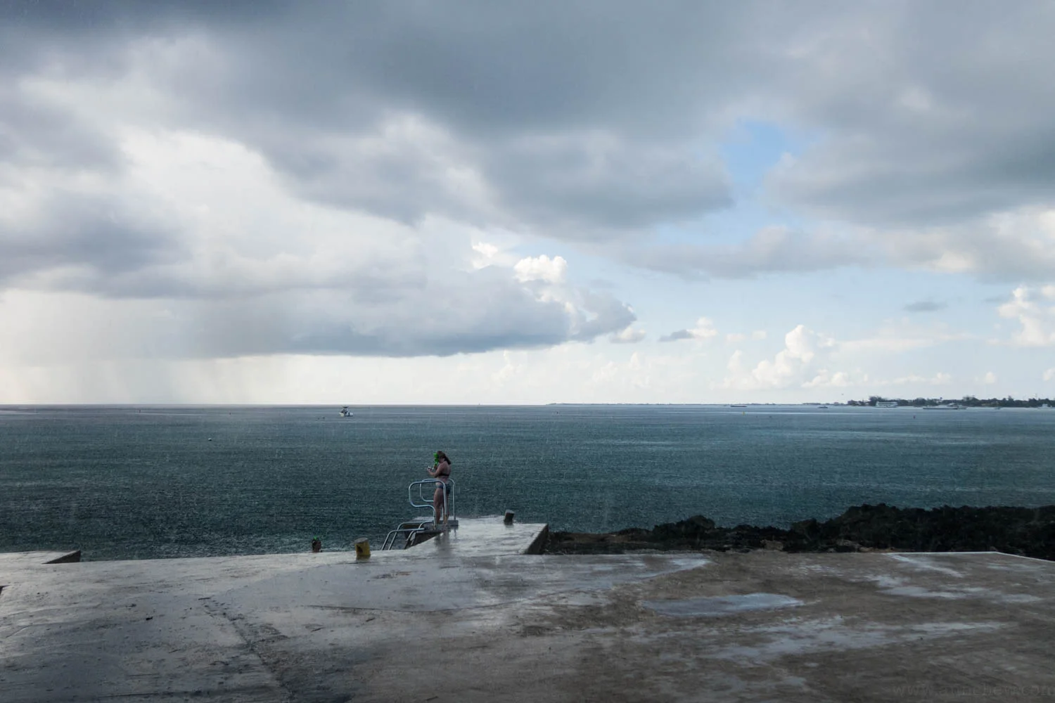 As we geared up a squall washed over the otherwise very flat seas.