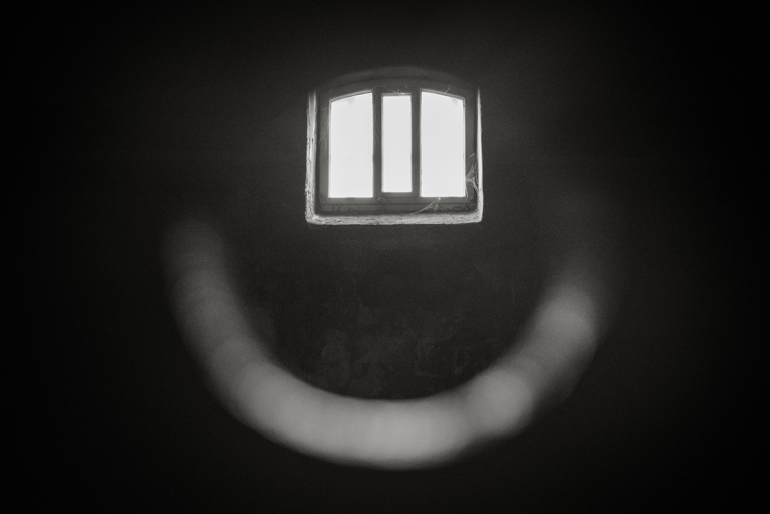 The cells had circular peepholes so guards could check in on prisoners. 