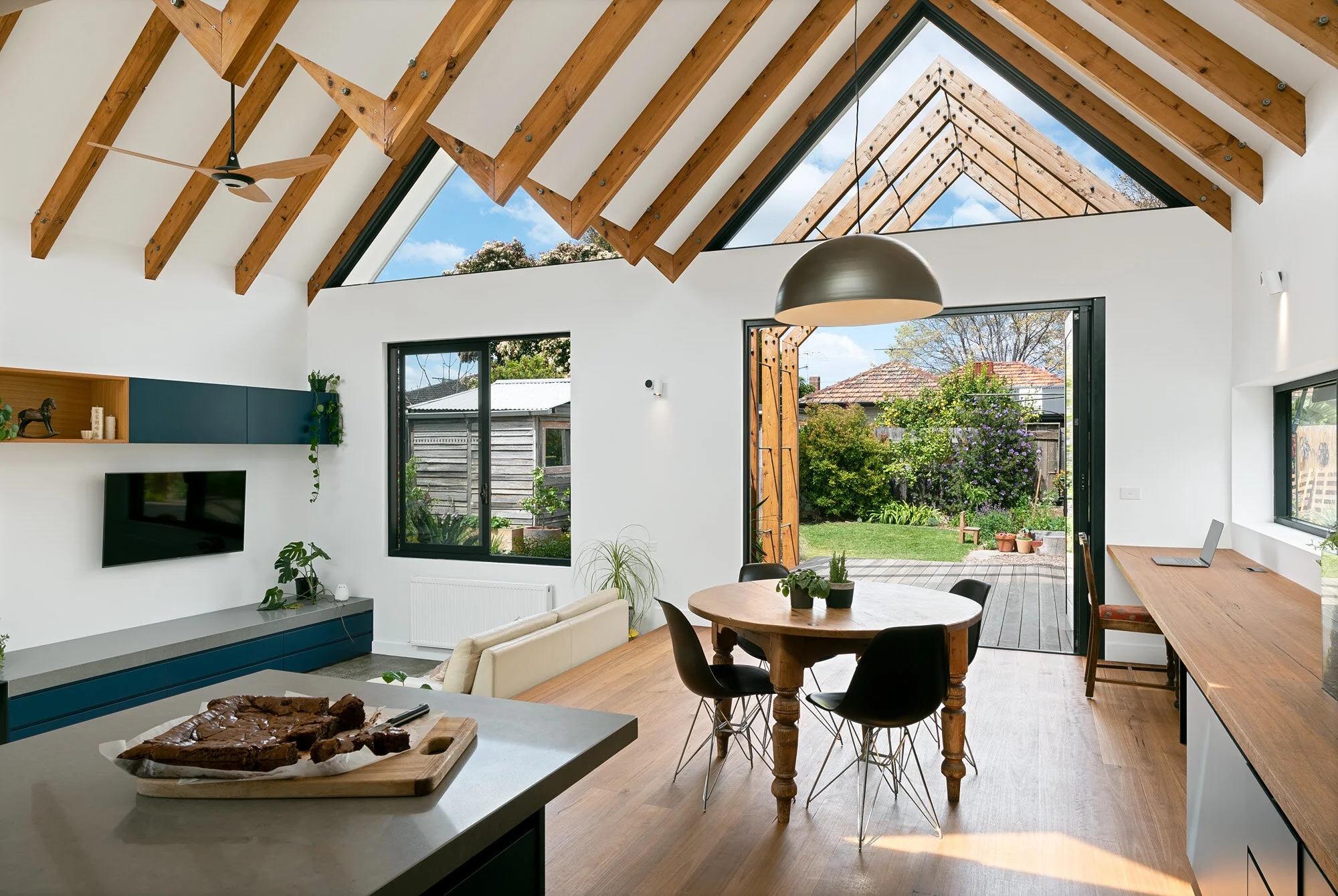 Kitchen connected to open plan dining, study and living