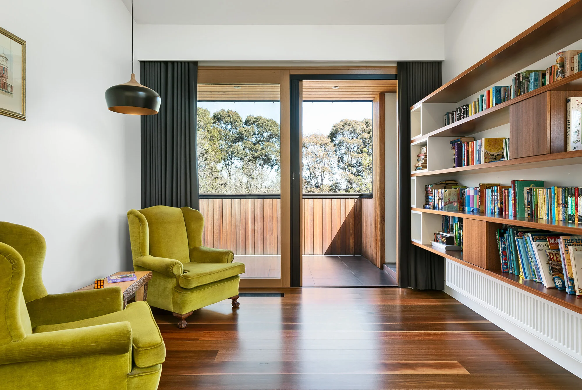 Sitting room with solid timber joinery and views to the Yarra River.