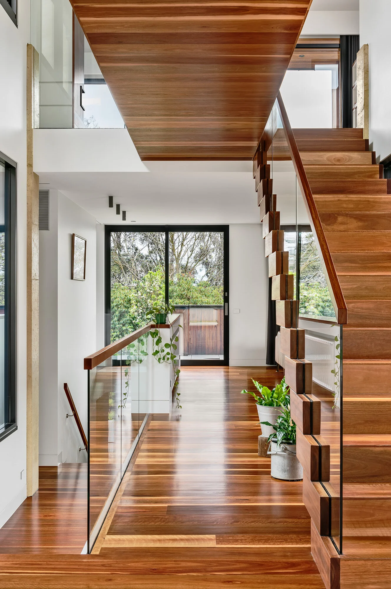 Timber clad stair and bridge over. Natural ventilation throughout.