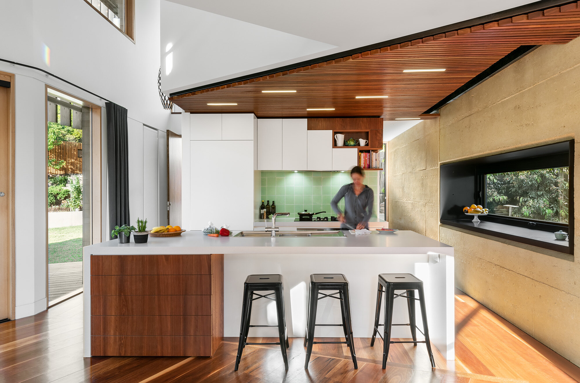 Efficient kitchen layout with double height void over
