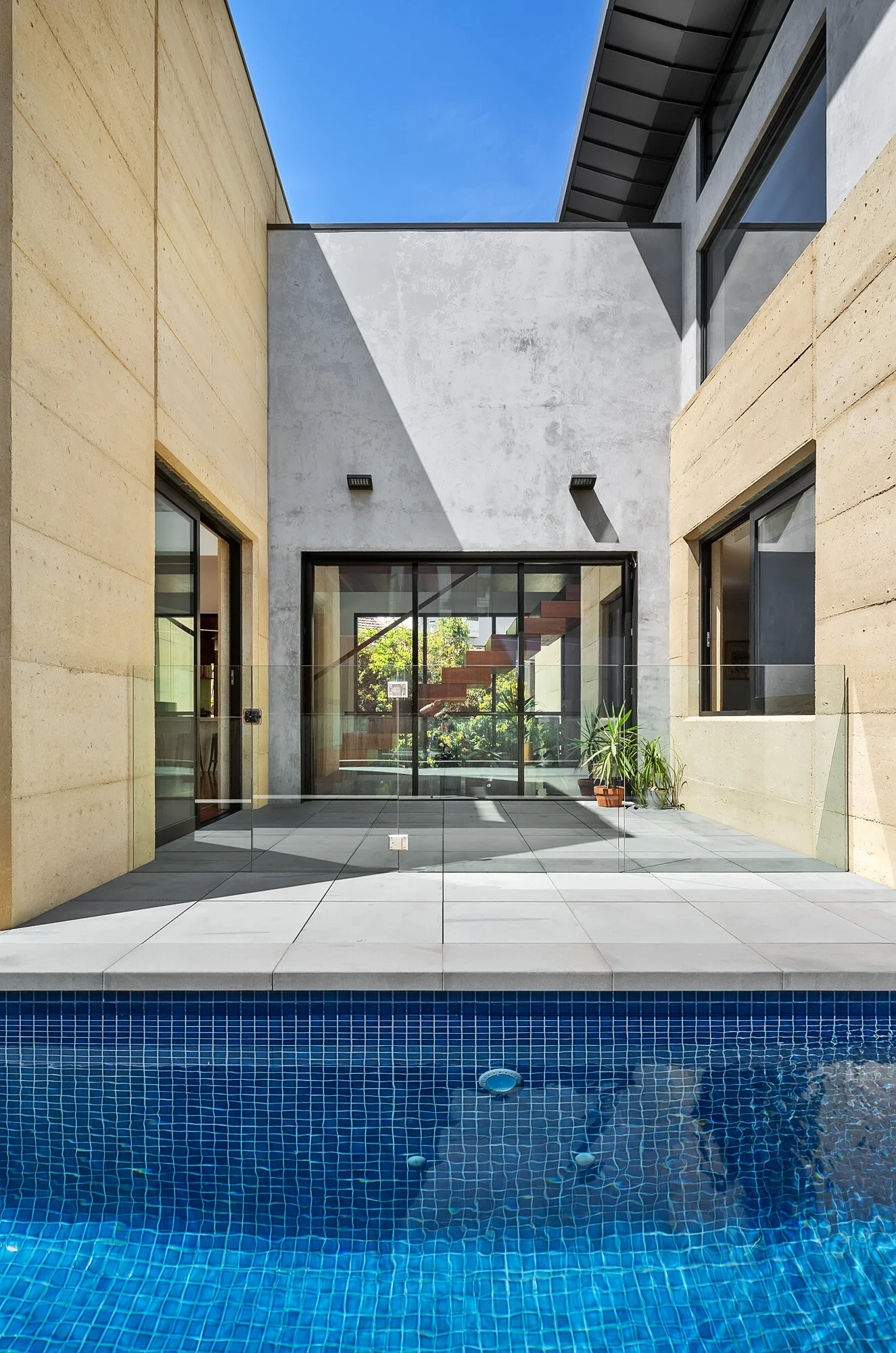 Swimming pool courtyard with direct access from living area.