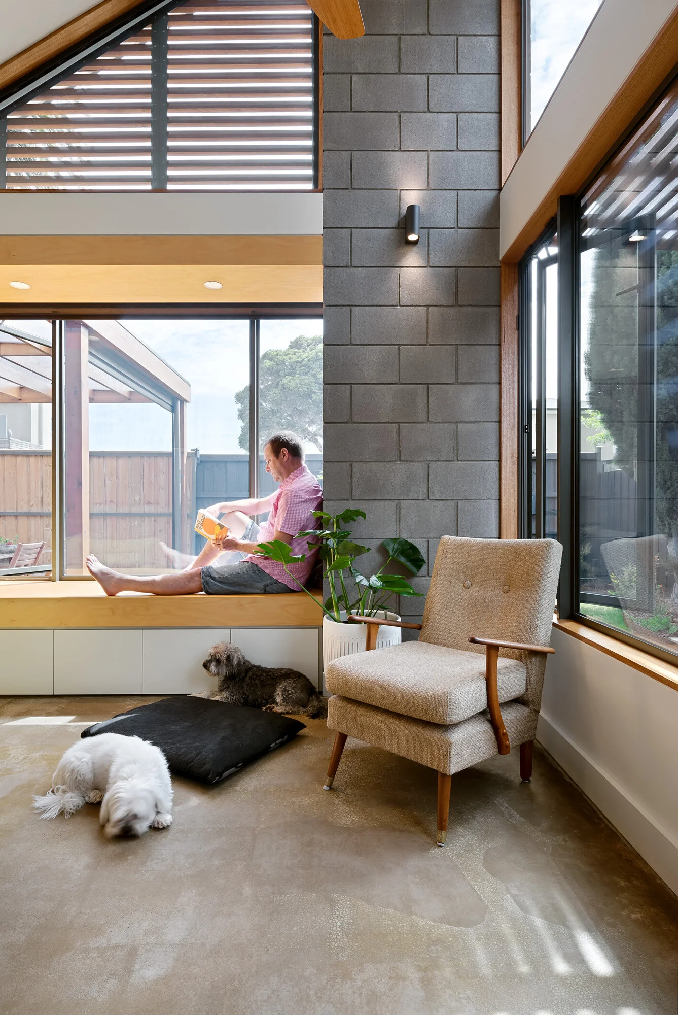 Sun bathed north facing window seat. Concrete block spine