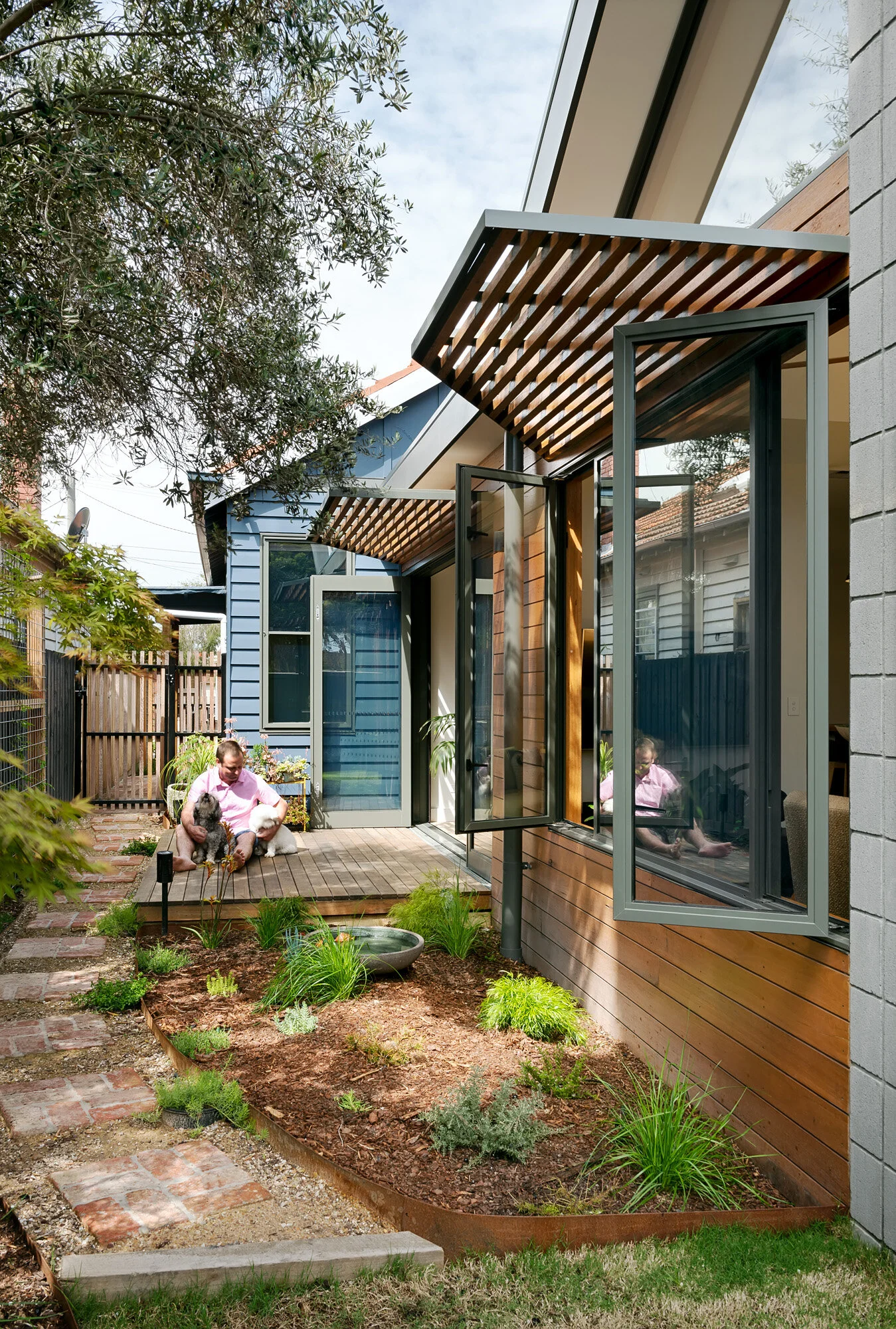 East facing deck. Shade hoods. Casement windows catch cooling breeze