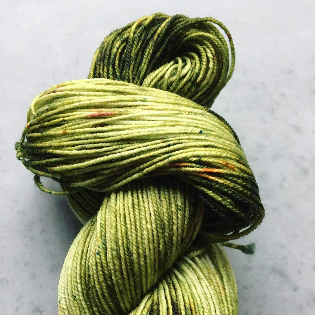 This speckled effect was acheived using our new Drunk Yarn dye packets. Simply unwind and lay your pre-soaked skein in a microwave safe dish, fill half way with water (don’t cover the skein), sprinkle the packet onto the skein, and then cook for 2 minute intervals until the water becomes mostly clear and the skein is hot to the touch. Allow to cool.
