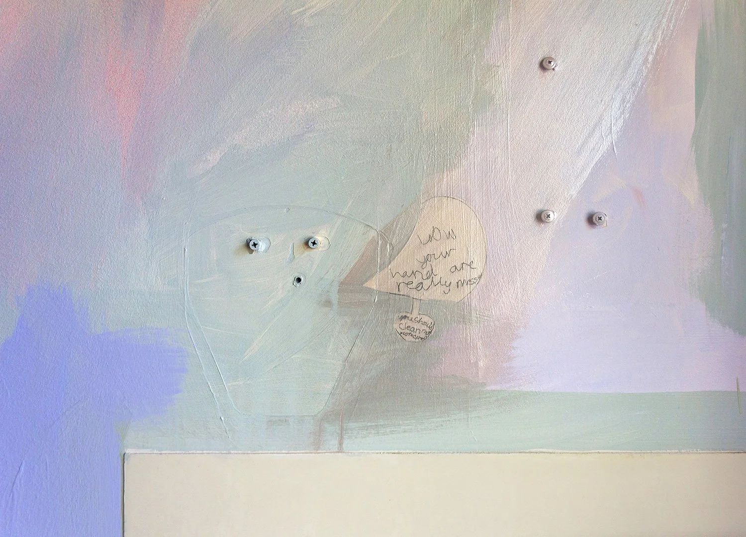 Close up detail of abstract pastel mural featuring a speech bubble with words scribbled by a child. ‘Wow your hand are really messy you should clean them.”
