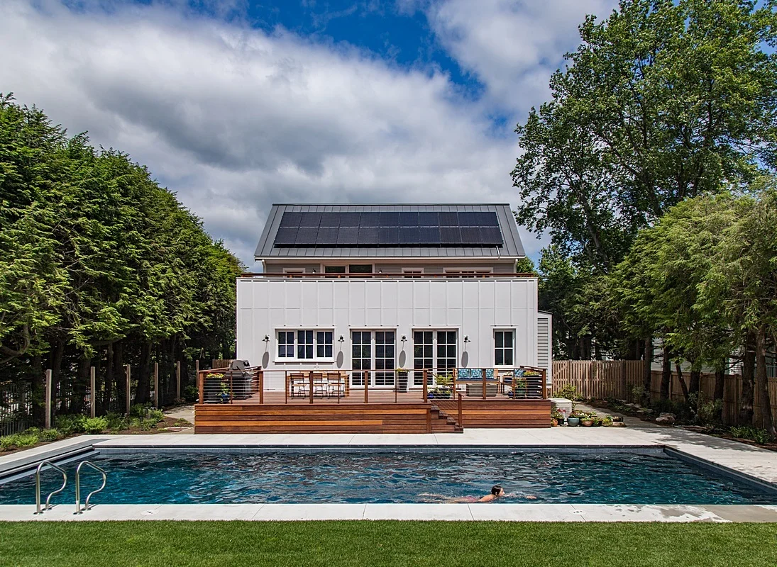 Rear exterior - solar system, pool, and deck