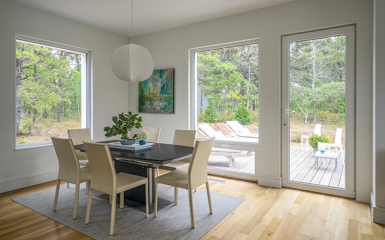 Interior dining space connected to exterior deck
