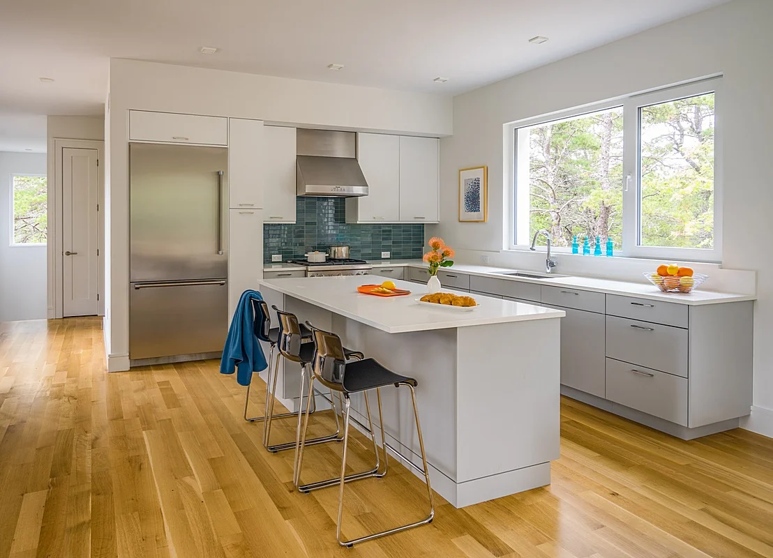 Main entry leading to modern kitchen