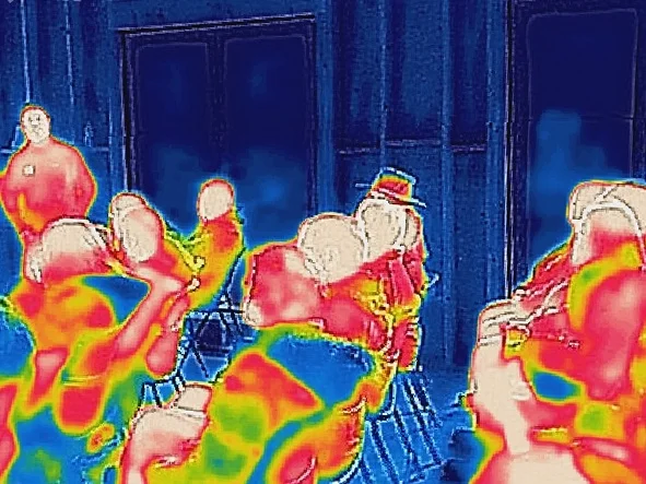 A thermal image shows the warm attendees on the cold and stormy day.