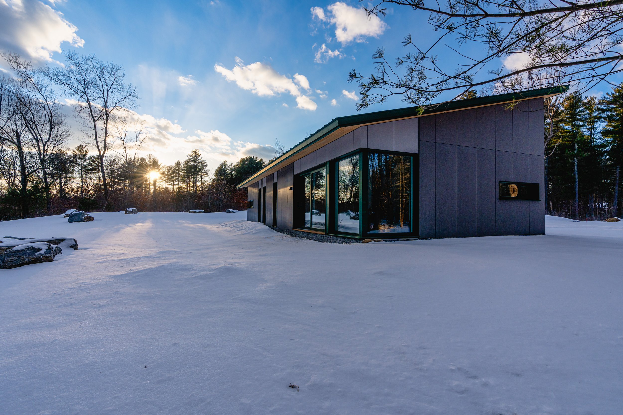 Dusk at a snowy Passive House