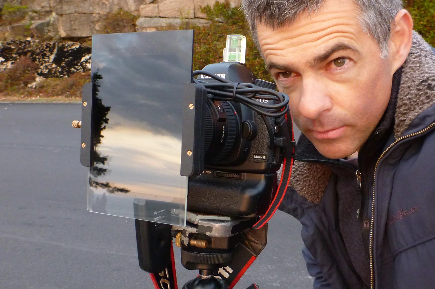 Graduated ND filters are usually rectangular and fit into a filter holder that screws onto the front of the lens. Then you can slide the filter up or down to match the horizon line in your composition.
