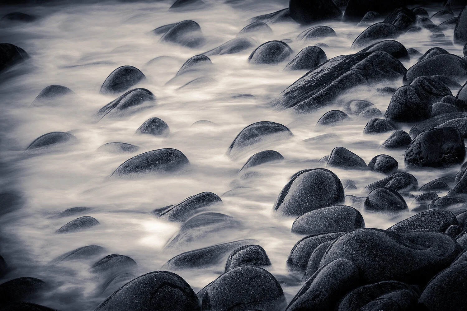 Waves crashing over rocks in the early morning along Ocean Drive