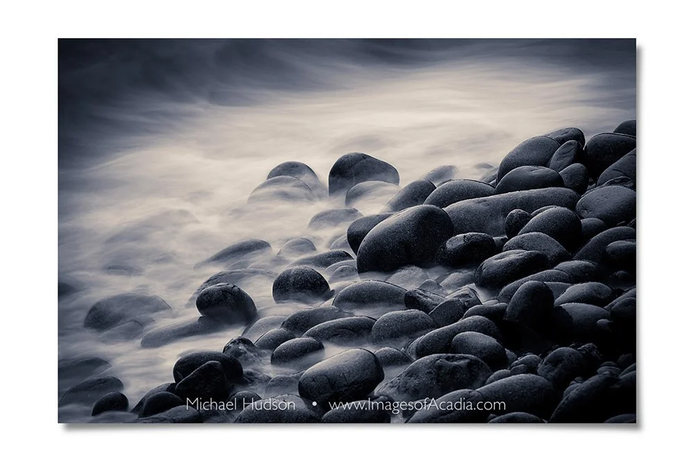 Waves washing over rocks in the early morning along Ocean Drive,