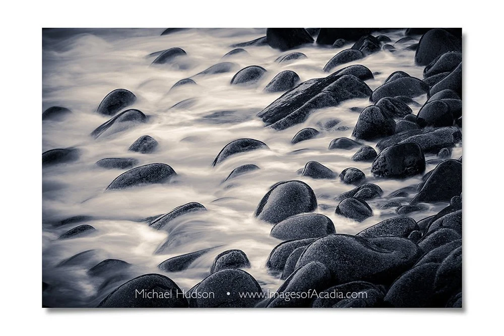 Waves crashing over rocks in the early morning along Ocean Drive