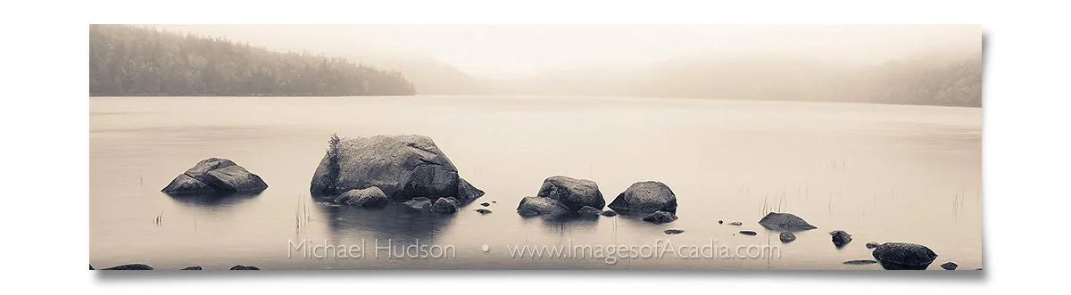 Rocks along the shallow shoreline of Jordan Pond, Acadia Nationa